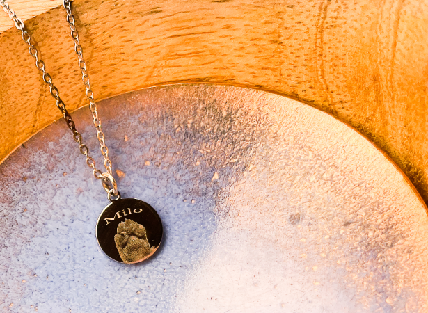 gold necklace with paw print